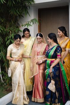 the bride and her friends are getting ready to go into their wedding ceremony in india