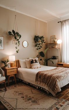 a bed room with a neatly made bed next to a window and a rug on the floor