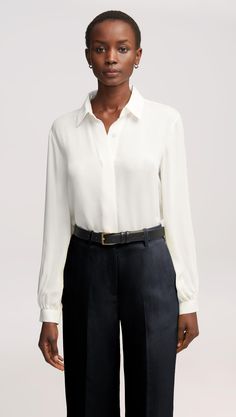 Here’s what happens when an everyday item piece gets an elegant twist. Made of airy Georgette silk, this versatile blouse features bubble sleeves, smart cuffs, and a relaxed fit for effortless layering. Pair with wide-leg trousers, heels, and bold accessories for a classy look that never misses. Classic Blouse With Balloon Sleeves And Button Cuffs, Timeless Silk Blouse For Daywear, Classic Tops For Workwear With Balloon Sleeves, Classic Workwear Top With Balloon Sleeves, Classic Balloon Sleeve Tops For Workwear, Classic Balloon Sleeve Top For Work, Elegant Tops With Balloon Sleeves And Button Cuffs, Elegant Balloon Sleeve Tops With Button Cuffs, Classic Silk Blouse With Cuffed Sleeves