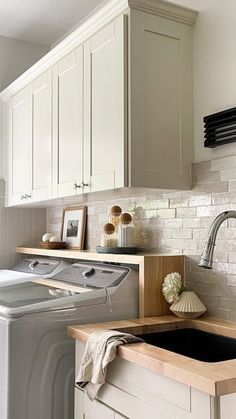 a washer and dryer in a small kitchen