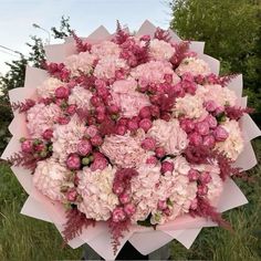 a large bouquet of pink and white flowers