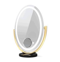 an illuminated mirror on a stand with a black base and gold trim around the edges