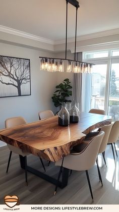 a wooden table with chairs around it in a living room next to a large window