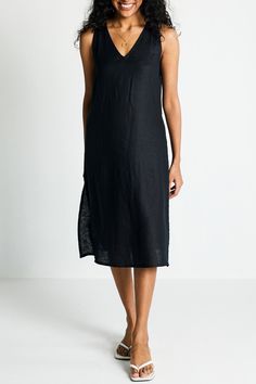 Introducing our Hemp V-Neck Straight Dress - an epitome of effortless elegance and minimalist chic. This midi-dress embodies modern sophistication with its clean lines and contemporary cut, embracing the essence of simplicity. Designed for versatility, it's a summer essential, perfect for various occasions. Its A-line fit offers comfort and style, while the V-neck and in-cut sleeves add a touch of allure. This stylish dress is complemented by functional pockets on both sides for practicality. Wa Chic V-neck Slip Dress With Side Slits, Black Linen V-neck Midi Dress, Black V-neck Midi Dress For Loungewear, Elegant Loungewear Dress With Side Slits, Elegant Unlined V-neck Midi Dress, Elegant V-neck Unlined Midi Dress, Chic Black Linen V-neck Dress, Modern Black Midi Dress For Daywear, Chic Black V-neck Linen Dress