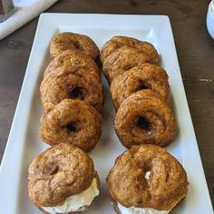 several pastries are arranged on a white plate