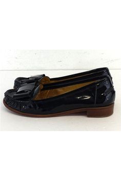 Size 6 M Black Patent Leather Loafers Made in Brazil Bow embellished toe Some outsole wear Heel height 1" Black Patent Leather Slip-on Tassel Loafers, Black Patent Leather Tassel Loafers With Round Toe, Black Casual Tassel Loafers With Almond Toe, Casual Black Tassel Loafers With Almond Toe, Black Flat Tassel Loafers With Leather Sole, Black Tassel Loafers With Round Toe For Spring, Black Slip-on Flats For Formal Occasions, Black Brogue Detailing Moccasins, Black Patent Leather Loafers With Low Heel