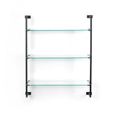 three glass shelves on the wall with black brackets