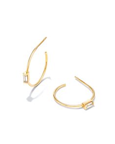 A modern variation on a classic design, the Isabella 14k Yellow Gold Hoop Earrings in White Diamond feature a solo baguette gemstone at the center of each silhouette. Designed to style for a lifetime, these timeless hoops are perfect for everyday and elevated enough for your most formal occasions.

We have taken steps to ensure that, when applicable, our diamonds are conflict free by requiring our suppliers to comply with the Kimberley Process. Baguette Gemstone, Baguette Diamond Earrings, Half Eternity Band, Yellow Gold Pendants, Baguette Diamond, Gold Pendant Necklace, Jewelry Earrings Hoops, Gold Hoop, Quality Diamonds