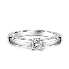 Simple and stunning, this ring showcases a magnificent round cut stone standing tall in the traditional four-prong setting, while additional round stones line the shank. So elegant it needs no further accompaniment, this ring is finished with a bright polished shine. The stones in this engagement ring shine brightly enough to be deserving as a symbol of your love.Carat Weight: 0.275 ctStone Size: 4 mmStone Type: Jeulia® StoneNumber of Stones: 1 Stone Color: Diamond WhiteStone Shape: RoundCarat Weight: 0.648 ctStone Size: 1.1,1.3,1.5 mmStone Type: Jeulia® StoneNumber of Stones: 32 Stone Color: Diamond WhiteStone Shape: RoundWeight: 2.7 gWidth: 1.7 mmHeight: 4.9 mmThickness: 1.2 mmMaterial: 925 SilverPlating Color: Silver Vs Clarity Stackable Rings Fine Jewelry, Classic Open Ring Crystal Ring With Diamond Accents, Classic Crystal Ring With Diamond Accents In Open Style, Classic Open Crystal Ring With Diamond Accents, Classic Crystal Ring With Diamond Accents Open Ring, Diamond White Round Solitaire Cluster Ring, Diamond White Solitaire Cluster Ring, Solitaire White Gold Halo Ring With Round Cut, Channel Set Stackable Round Rings