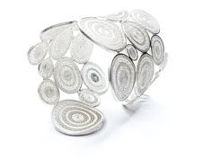 This majestic cuff bracelet is elegance at its peak. 73.6gr (~25oz) of impeccably-designed sterling silver with the filigree technique of award-winning artisans. Luxury Silver Filigree Bracelet, Silver Filigree Luxury Bracelet, Handmade Luxury Sterling Silver Bangle, Luxury Handmade Sterling Silver Bangle, White Sterling Silver Bracelets, Unique White Sterling Silver Bracelets, Unique Silver Filigree Bracelet, Unique Silver Filigree Cuff Bracelet, White Sterling Silver Bracelet