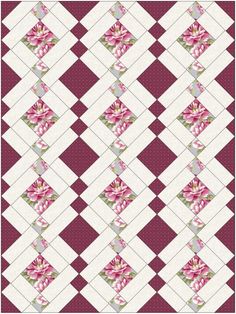 a red and white checkered quilt with pink flowers on the front, in an argyle pattern