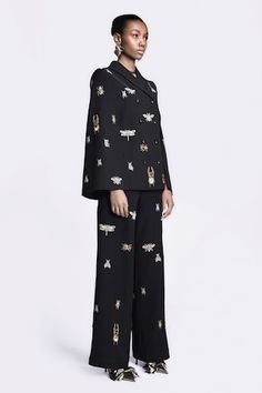 Black flared pant with all over lady bug embroidery. - Aza Fashions Shahin Mannan, Bug Embroidery, Bug Pants, Bugs Embroidery, Japanese Crepe, Cape For Women, Japanese Crepes, Black Japanese, Black Flare Pants