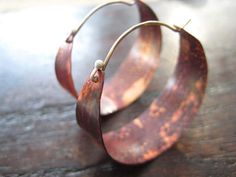 They have been a very popular pair! The color on the copper is due to the Flame-patina, which is a spontaneous process and allows for an array of red/orange colors patterns, no two are exactly alike. They are hammered and waxed. Very lightweight! Sterling ear wire fits into hole in back of hoop to close. 1 1/2" diameter. Copper Jewellery, Earring Inspiration, Metal Smithing, Necklace Initial, Earrings Inspiration, Earring Ideas, Large Hoop Earrings, Jewellery Ideas, I Love Jewelry