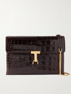 You'll find yourself reaching for TOM FORD's 'Monarch' bag for just about every event, thanks to its chic yet simple design. Made from glossy croc-effect leather, it has a flap silhouette and detachable shoulder strap so you can wear it as a clutch, too. Store your phone, glasses and cosmetics inside, and use the zipped pocket to secure your keys and cards. Tom Ford Bags, Designer Cosmetic Bag, Tom Ford Handbags, The Saint, Leather Design, Leather Accessories