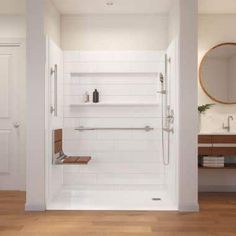 a bathroom with white walls and wooden flooring next to a mirror on the wall