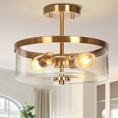 a glass and brass chandelier in a living room