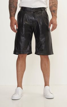 Elevate your wardrobe with the ultimate statement in luxury and style: Men's Genuine Lambskin Leather Shorts. Crafted from the finest lambskin leather, these shorts offer an unmatched softness and a supple texture that gracefully conforms to your body, providing not just comfort but a flattering fit that enhances your silhouette. The natural breathability of lambskin ensures these shorts remain comfortable even on warmer days, blending functionality with finesse. Perfect for a range of occasions Short Leather Bottoms With Belt Loops, Black Leather Bottoms With Built-in Shorts, Luxury Black Leather Bottoms, Fitted Leather Shorts, Fitted Short Leather Pants, Luxury Black Short Bottoms, Casual Black Leather Shorts, Fitted Black Leather Shorts, Casual Leather Shorts With Belt Loops