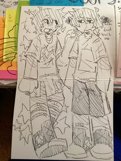 a drawing of two people standing next to each other in front of some colored papers