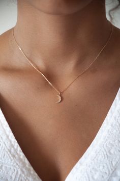 Our Mini Crescent Moon necklace is made in 14k solid gold, set with 7 pretty champagne diamonds and hangs from a delicate 14k gold cable chain. Details:14k solid gold Moon Charm 10mm x 7mmChampagne diamonds 7 pieces14k solid gold cable chain 16 inches14k spring ring clasp Tiny Necklace, Dope Jewelry, Crescent Moon Necklace, Classy Jewelry, Gold Necklace Designs, Delicate Jewelry, Diy Schmuck, Girly Jewelry, Moon Necklace