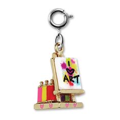 a keychain with a painting on the front and back of it's frame