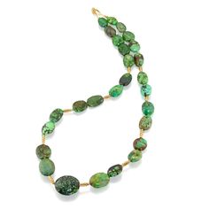 This stunning natural green turquoise necklace showcases this unique stone. It is strung with our signature crownwork® gold barrel beads and finished with an 18k yellow gold lillypad clasp. This is the perfect piece for every style, layer with other necklaces or wear as a statement on its own. MATERIAL: 18k Yellow Gold STONE TYPE: Natural Green Turquoise DIMENSIONS: 22" Elegant Green Turquoise Necklace In Chrysocolla, Elegant Green Chrysocolla Turquoise Necklace, Elegant Green Turquoise Chrysocolla Necklace, Green Chrysocolla Single Strand Necklace, Artisan Green Turquoise Single Strand Necklace, Green Single-strand Jewelry With Oval Beads, Green Oval Single Strand Jewelry, Artisan Green Single Strand Jewelry, European Jewelry