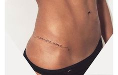 a woman's stomach with the word love written on her lower back and side