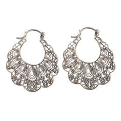 These lacy filigree hoop earrings are the design of Neetu Barathi in India. The earrings are crafted of sterling silver and feature delicate wirework within their scalloped forms. Delicate Silver Festival Jewelry, Delicate Silver Jewelry For Festivals, Delicate Silver Jewelry For Summer, Delicate Silver Summer Jewelry, Sterling Silver Hoop Earrings For Summer, Silver Pierced Jewelry For Summer, Silver Teardrop Jewelry For Summer, Ornate Handmade Hoop Earrings, Handmade Ornate Hoop Earrings