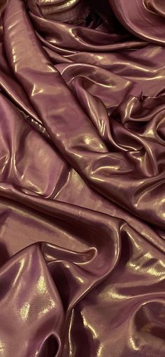 a close up view of shiny purple fabric