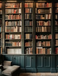 a room with many bookshelves filled with lots of books