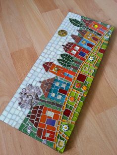 a colorful mosaic tile table runner on the floor