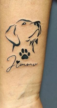 a dog's paw and name tattoo on the wrist is shown in black ink