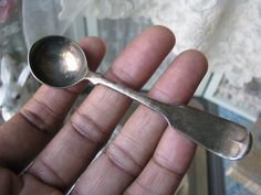 a person holding a spoon in their hand