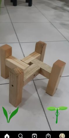 a wooden bench sitting on top of a tile floor next to a green dragon figurine