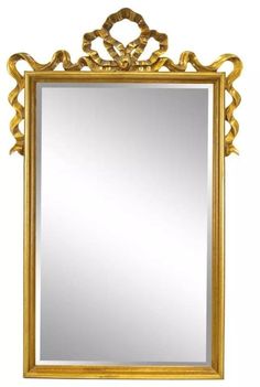 an ornate gold framed mirror on a white background