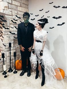 a man and woman dressed up in halloween costumes