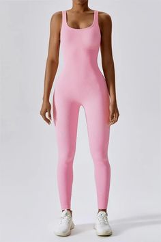 Made from our seamless ribbed material, this body-hugging bodysuit is ideal for a range of activities including yoga, fitness classes, and even everyday errands. Its sleeveless design boasts a flattering plunge neckline and an open back that allows for optimal ventilation during even the most vigorous workouts. With it Sporty Seamless Sleeveless Bodysuit, Sleeveless Pink Workout Bodysuit, Compressive Sleeveless Sports Bodysuit, Micro-elastic Sleeveless Bodysuit For Yoga, Pink High-stretch Sleeveless Activewear, Plunging Neckline