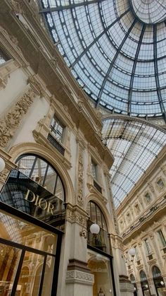 the inside of a building with glass ceiling