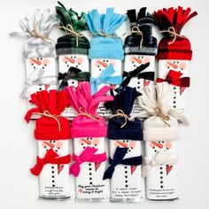 the snowmen are all wrapped up in different colors