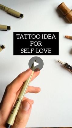 a person holding a pencil in their hand and writing on a piece of paper with the words tattoo idea for self - love