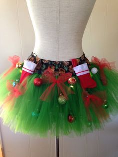 a green tutu skirt with christmas decorations on it