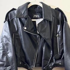 Elevate Your Style With This Zara Faux Leather Crop Biker Jacket, A Must-Have For Fashion-Forward Individuals. This Authentic Jacket Is Brand New With Tags, Ensuring You Receive It In Pristine Condition. Premium Faux Leather: Achieve The Edgy Look With High-Quality Faux Leather That Looks And Feels Like The Real Deal. Stylish Crop Design: The Cropped Cut Adds A Modern Twist To The Classic Biker Jacket, Perfect For Layering Over Your Favorite Outfits. Versatile Size S: Designed To Fit Comfortably Trendy Black Leather Biker Jacket, Zara Edgy Leather Outerwear, Zara Edgy Leather Jacket, Edgy Zara Leather Jacket, Zara Leather Biker Jacket For Work, Zara Leather Biker Jacket For Spring, Zara Leather Biker Jacket Spring Collection, Zara Moto Outerwear For Streetwear, Zara Black Leather Jacket For Streetwear