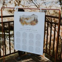 a wedding seating chart hanging on a fence