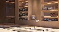 a room with yoga mats, vases and other items