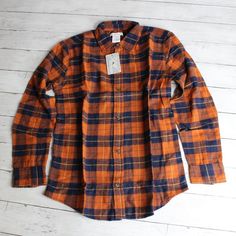 New With Tags Tommy Bahama Button Down Plaid Flannel Shirt 100% Cotton Fall Winter Youth Boy's Size Xxl Xx-Large 16 This Long Sleeve Button Up Flannel Shirt Is Navy Blue, Brown-Ish Orange And Golden Yellow Plaid. It Has A Full Button Up Front. It's A Really Sharp Looking Shirt And Is Brand New With Tags. Orange Long Sleeve Shirt For Fall, Orange Fall Shirt With Button Closure, Fall Orange Shirt With Button Closure, Classic Orange Tops For Fall, Classic Orange Top For Fall, Orange Cotton Long Sleeve Shirt, Collared Orange Shirt With Buttons, Orange Collared Shirt With Buttons, Classic Orange Shirt For Fall