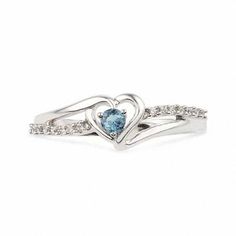 Sweet and so romantic, this birthstone ring is certain to win her heart. Beautifully crafted in sleek sterling silver, this ring features a heart-shaped frame centered with a glistening icy-blue aquamarine, the traditional gemstone for those born in March. A ribbon of shimmering diamond accents sweeps across the style, adding brilliant sparkle. Buffed to a polished luster, this ring is certain to become a treasured favorite. Custom made to fit her ring size. Sterling silver rings cannot be resized after purchase. Aquamarine Birthstone Diamond Promise Ring, Light Blue Birthstone Ring For Promise, Light Blue Promise Ring With Birthstone, Heart Cut Blue Topaz Promise Ring, Silver Heart Ring With Birthstone For Proposal, Heart Cut Topaz Ring With Accent Stones For Promise, Heart Cut Blue Topaz Rings For Anniversary, Heart Cut Topaz Birthstone Ring For Anniversary, Light Blue Topaz Birthstone Ring For Anniversary