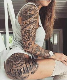 a woman with tattoos on her arm and leg