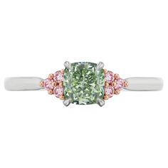 We are pleased to offer this Rare GIA Certified Natural Fancy Green & Pink Diamond Ring. This stunning ring features a GIA certified 0.80ctw natural fancy grayish green cushion cut diamond accented by 0.10ctw natural pink round brilliant cut diamonds set in platinum and 18k rose gold. The ring is in new condition and can be resized to fit your needs. We specializes in custom designed jewelry made from the finest materials to your exact specifications. Please give us a call for pricing informatio Golconda Diamond, Pear Cut Diamond Ring, European Cut Diamond Ring, Pear Diamond Rings, Pink Diamond Ring, Emerald Cut Diamond Ring, Blue Diamond Ring, Platinum Diamond Engagement Rings, Platinum Diamond Rings