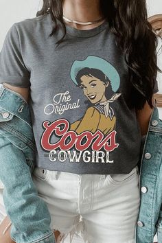 Show off your love for the Wild West with The Original Coors Cowgirl Graphic T Shirts. Made with soft and comfortable material, these shirts showcase a classic cowgirl riding a horse with the iconic Coors logo in the background. Perfect for any cowgirl or beer lover in your life! SPECIFICATIONS: Unisex Crew Neck Short Sleeve Tees. Crafted from premium materials, tailored to your lifestyle, ensuring a comfortable fit for any occasion. Family Group Uniforms Birthday Party Gift Concert Festival Events. High Quality Direct To Film Printed Graphic Design. 100%COTTON,HEATHER(52%COTTON,48%POLY),ATH.HEATHER,BLACK HEATHER(90%COTTON,10%POLY) Made In: Nicaragua Coors Logo, Classic Cowgirl, Cowgirl Graphic, Riding A Horse, Green Ash, Concert Festival, Film Prints, The Wild West, Birthday Party Gift