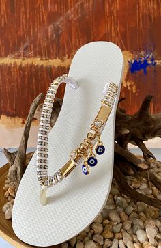 Get ready to fall in love with this fancy Design by Desire Flip Flops. Rich ornaments and elegant color make this sandals perfect to accompany you in unique and stylish looks.All sandals are handcrafted with the finest Brazilian embellishments. We use the original Havaianas®️: thong style made in Brazil 100% rubber non slip tread durable and flexible Customized items are final sale so they can’t be returned. Bohemian Embellished Party Sandals, Elegant Handmade Beach Sandals, Elegant Gold Sandals For Festivals, Elegant Embellished Festival Sandals, Elegant Beaded Beach Sandals, Elegant Beaded Sandals For Beach, Elegant Embellished Sandals For Festivals, Gold Beaded Sandals For Festival, Bohemian Embellished Sandals For The Beach