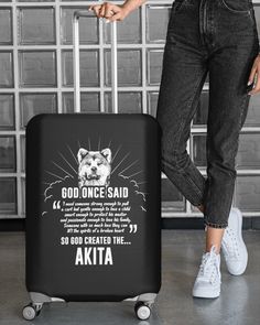 a woman is pulling a suitcase with the words god once said and an animal on it